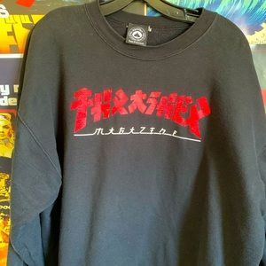 Thrasher “Godzilla” black and red crewneck sweater.